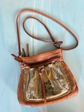Fossil Leather Tan Crossbody Bag w floral patterns. Awesome storage. Great shape